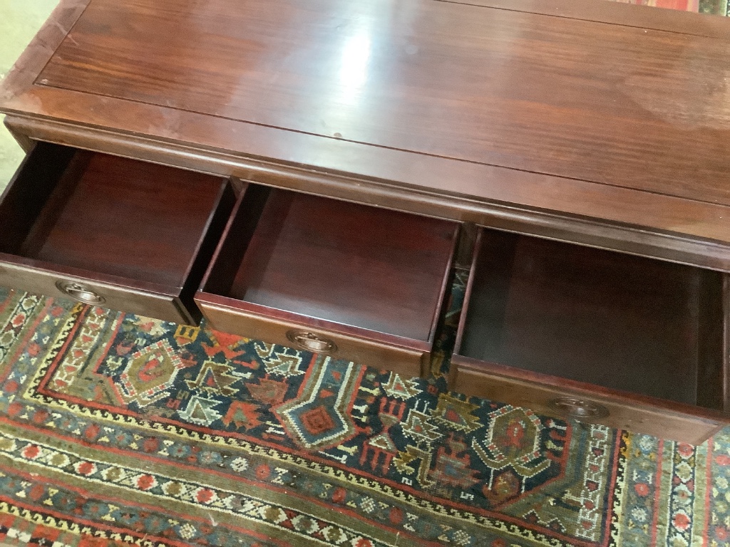 A Chinese hardwood rectangular three drawer coffee table, width 136cm, depth 51cm, height 40cm